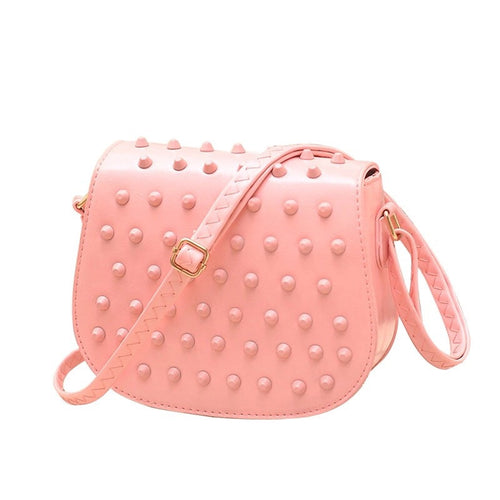 peach sling bag with monotonous studs edgability